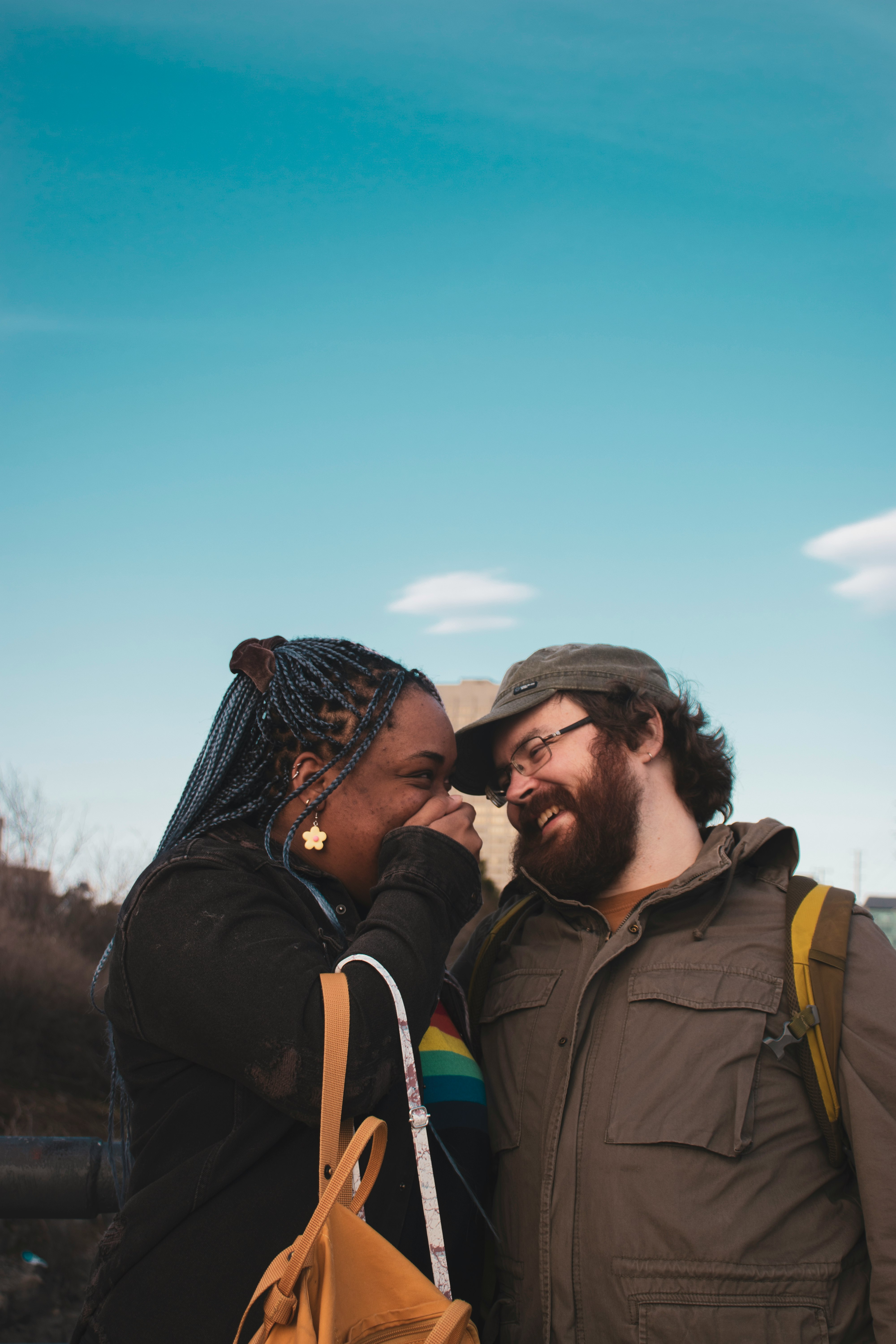 man and woman kissing during daytime